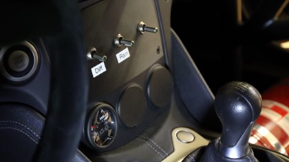 Center console of a Nissan 370z racecar, fitted with custom designed switch plates and covers.