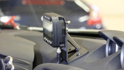 Custom designed, carbon fiber GoPro mount attached to the dashboard of a Solidxperts Nissan 370z racecar.