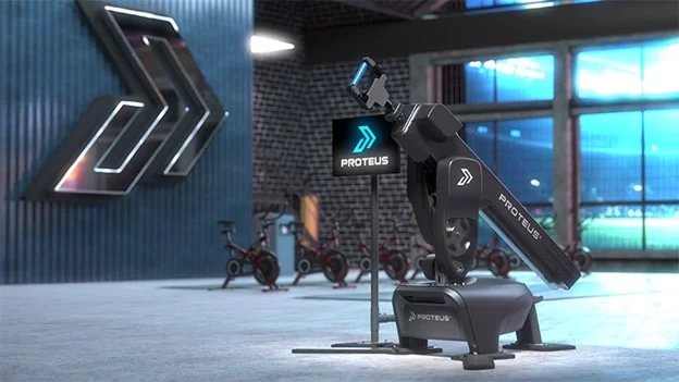 A photorealistic rendering of the Proteus Motion system displayed in a modern gym environment.