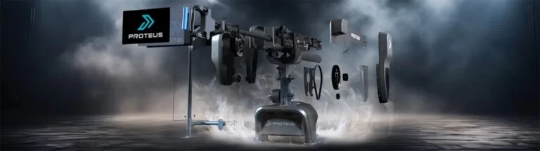 An exploded view of the Proteus Motion system, showing its internal components arranged in a dramatic visual style with a smoky, industrial background.